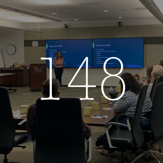 2024 Financial Literacy hours 148. Photo of CRBT employee teaching financial education.